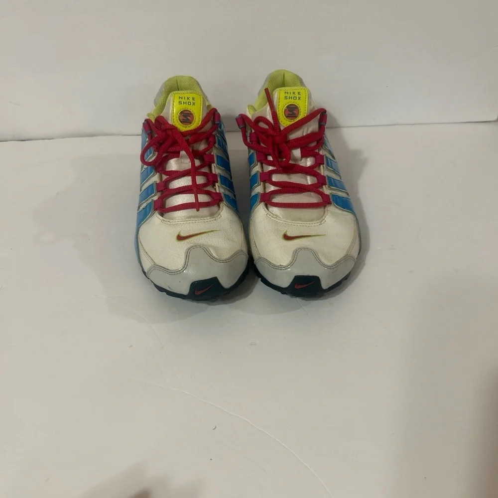 Nike Kids Shox Sneakers in White with Blue, Pink & Neon Yellow Accents